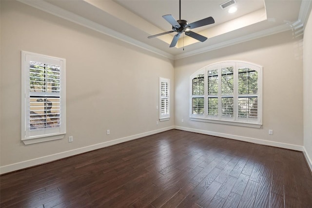 1036 Liberty Park Dr Unit 401/4A, Austin, TX 78746 - empty room featuring a tray ceiling, ornamental molding, dark wood-type flooring, a ceiling fan, and baseboards