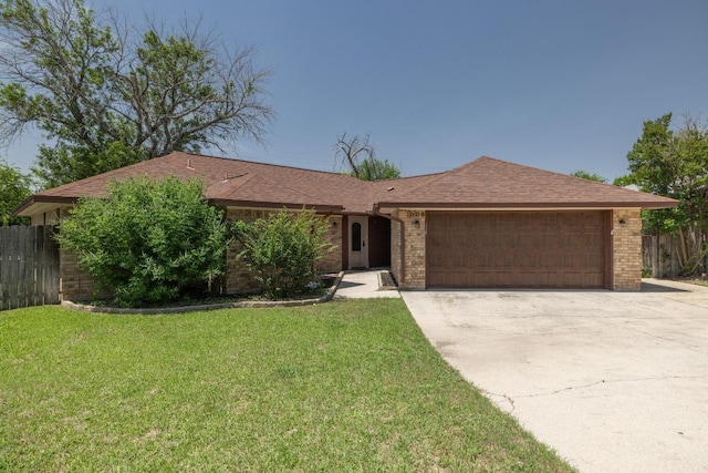 1008 Woodshadows Dr, Harker Heights, TX 76548 - ranch-style home featuring a garage, brick siding, and driveway