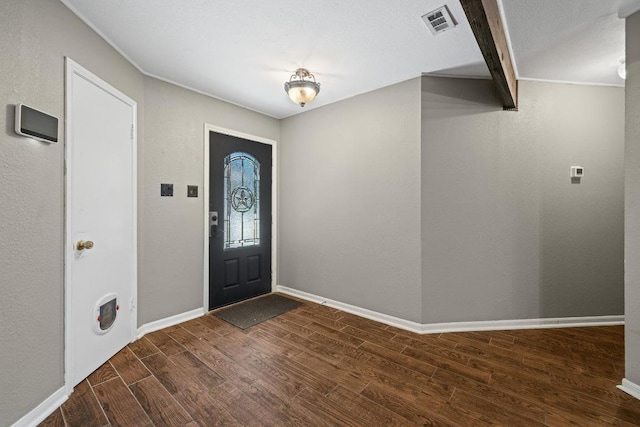 1008 Woodshadows Dr, Harker Heights, TX 76548 - entrance foyer featuring dark wood-style flooring and baseboards