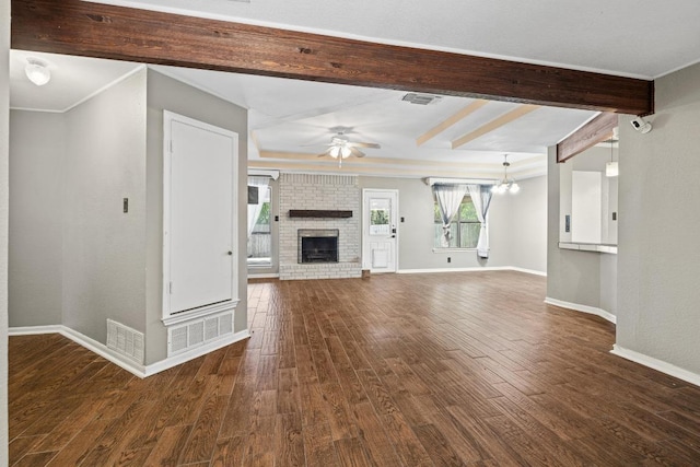 1008 Woodshadows Dr, Harker Heights, TX 76548 - unfurnished living room with ceiling fan, dark wood finished floors, beamed ceiling, baseboards, and a fireplace