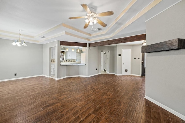 1008 Woodshadows Dr, Harker Heights, TX 76548 - unfurnished living room featuring a tray ceiling, ceiling fan, a chandelier, wood finished floors, and baseboards