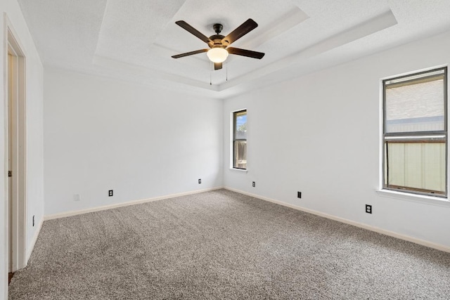 1008 Woodshadows Dr, Harker Heights, TX 76548 - carpeted empty room featuring a raised ceiling, ceiling fan, and baseboards