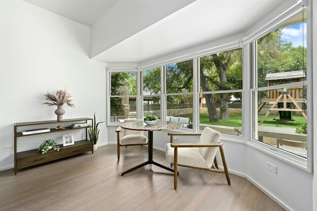 1112 W 10th St, Austin, TX 78703 - sunroom with plenty of natural light, wood finished floors, and baseboards