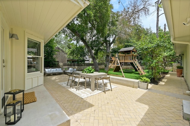 1112 W 10th St, Austin, TX 78703 - fenced backyard featuring a playground, a patio area, outdoor dining space, and an outdoor living space