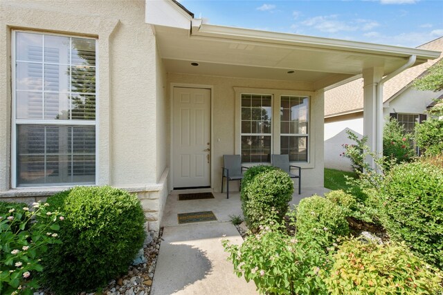 112 Anemone Way, Georgetown, TX 78633 - property entrance featuring stucco siding and a porch