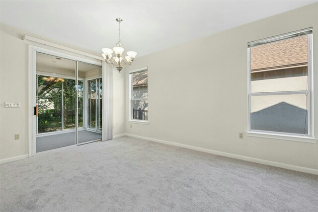 112 Anemone Way, Georgetown, TX 78633 - carpeted spare room featuring a chandelier and baseboards