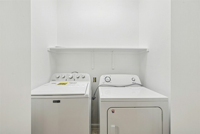 112 Anemone Way, Georgetown, TX 78633 - laundry area with washer and clothes dryer