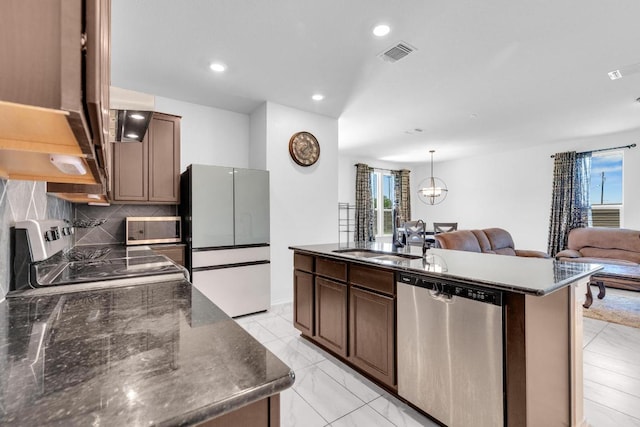 14516 Isidors Eagle Way, Elgin, TX 78621 - kitchen with stainless steel dishwasher, freestanding refrigerator, a sink, electric stove, and healthy amount of natural light