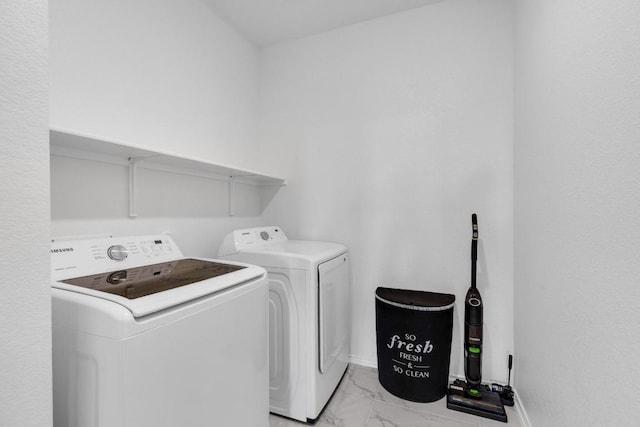 14516 Isidors Eagle Way, Elgin, TX 78621 - laundry room with light marble finish flooring and separate washer and dryer