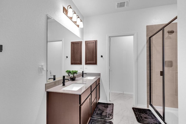14516 Isidors Eagle Way, Elgin, TX 78621 - full bath featuring marble look tile flooring, double vanity, a shower stall, a textured wall, and baseboards