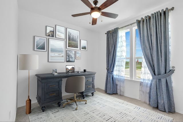 14516 Isidors Eagle Way, Elgin, TX 78621 - home office featuring light carpet, ceiling fan, and baseboards