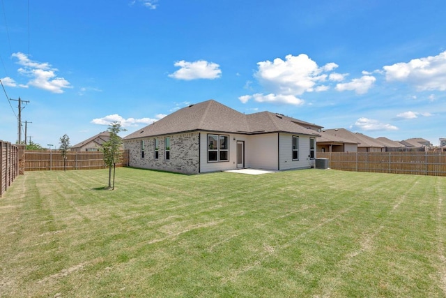 14516 Isidors Eagle Way, Elgin, TX 78621 - rear view of property with central AC, a patio, and brick siding