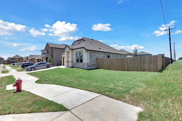 14516 Isidors Eagle Way, Elgin, TX 78621 - view of property exterior with concrete driveway, stone siding, brick siding, and an attached garage