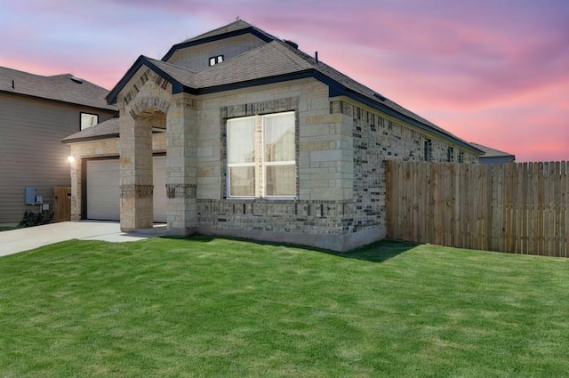 14516 Isidors Eagle Way, Elgin, TX 78621 - view of front of property with stone siding, driveway, and a garage