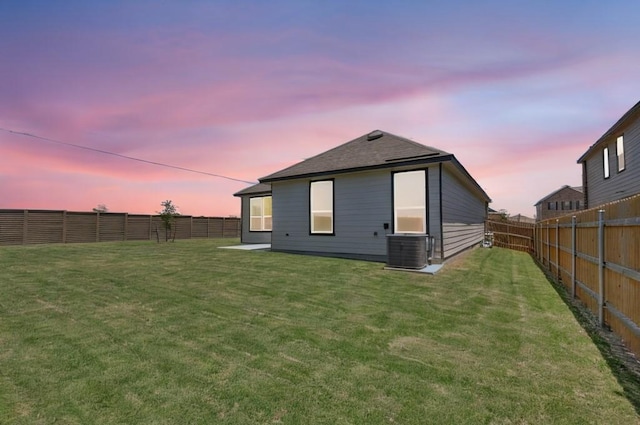14516 Isidors Eagle Way, Elgin, TX 78621 - back of house at dusk featuring a fenced backyard