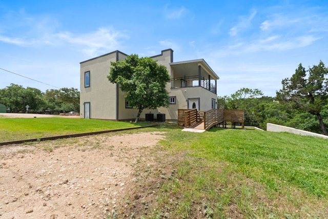 757 Canyon Bnd, Canyon Lake, TX 78133 - back of property with a balcony and a yard