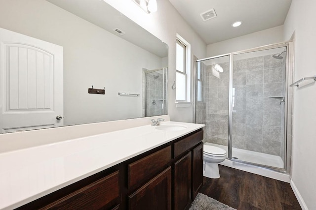 328 Triumph Rd, Buda, TX 78610 - full bath featuring toilet, vanity, a stall shower, wood finished floors, and recessed lighting