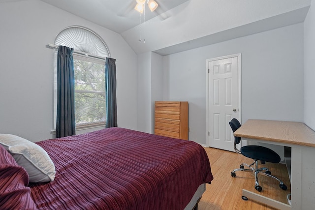 11713 Rydalwater Ln, Austin, TX 78754 - bedroom with light wood finished floors, vaulted ceiling, and a ceiling fan