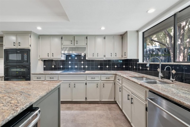 1302 Wilderness Dr, Austin, TX 78746 - kitchen with black appliances, a sink, range hood, light stone countertops, and backsplash