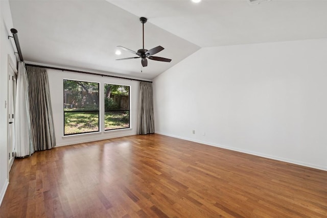 1302 Wilderness Dr, Austin, TX 78746 - spare room with vaulted ceiling, ceiling fan, wood finished floors, baseboards, and recessed lighting