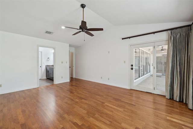 1302 Wilderness Dr, Austin, TX 78746 - unfurnished room featuring ceiling fan, lofted ceiling, light wood-style flooring, and baseboards