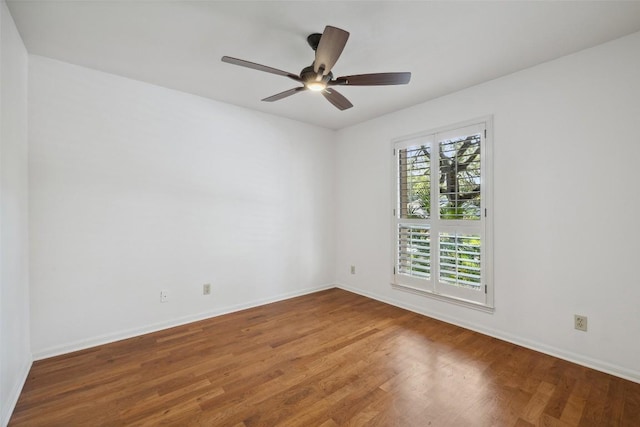 1302 Wilderness Dr, Austin, TX 78746 - empty room featuring wood finished floors, baseboards, and ceiling fan