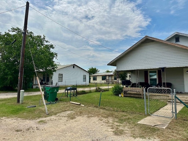 411 N Swenson St Unit 411, Falls City, TX 78113 - view of side of home featuring a gate and covered porch
