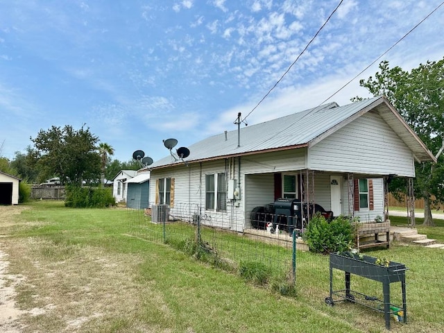 411 N Swenson St Unit 411, Falls City, TX 78113 - rear view of property with a porch and central AC unit