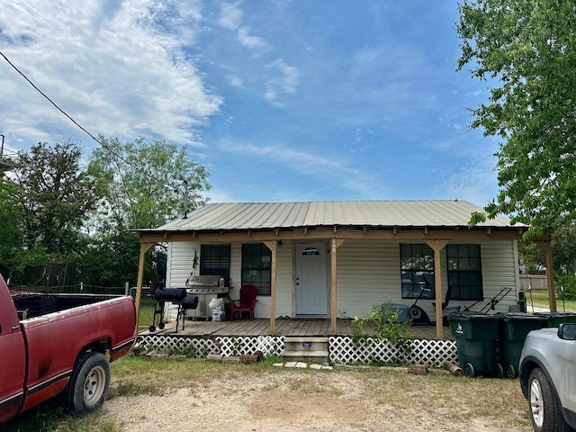 411 N Swenson St Unit 411, Falls City, TX 78113 - view of front of house featuring a porch and metal roof