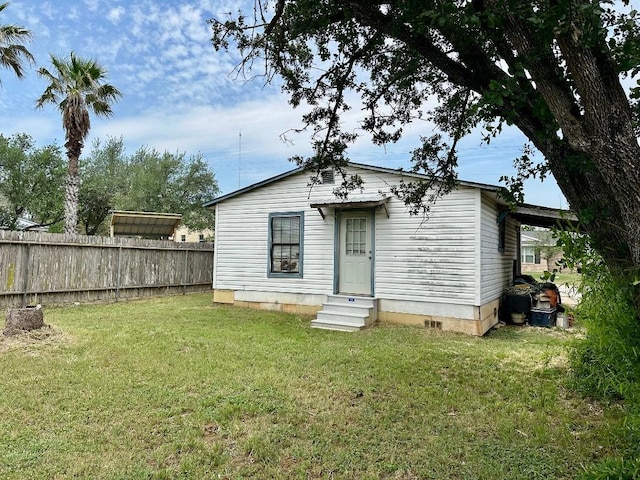 411 N Swenson St Unit 411, Falls City, TX 78113 - rear view of property featuring entry steps