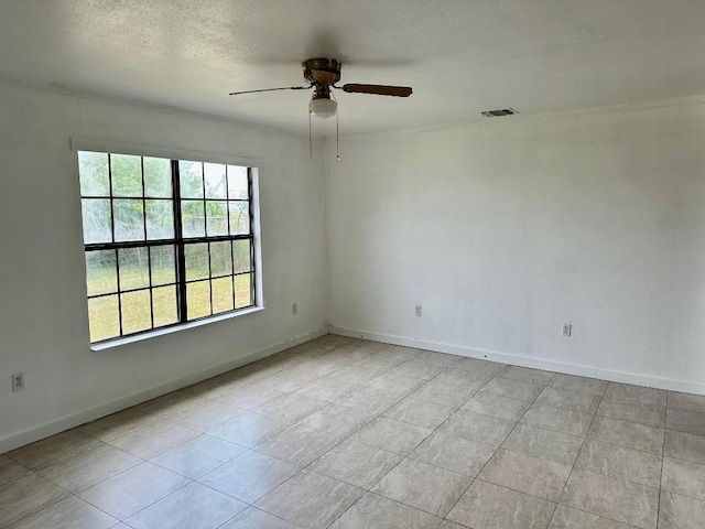 411 N Swenson St Unit 411, Falls City, TX 78113 - unfurnished room featuring ceiling fan, baseboards, light tile patterned floors, and a textured ceiling