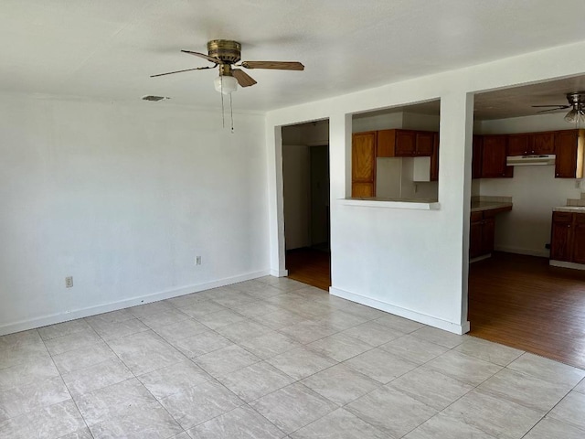 411 N Swenson St Unit 411, Falls City, TX 78113 - unfurnished living room with a ceiling fan, baseboards, and light tile patterned flooring