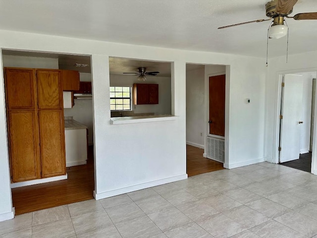 411 N Swenson St Unit 411, Falls City, TX 78113 - spare room with ceiling fan, baseboards, and light tile patterned flooring