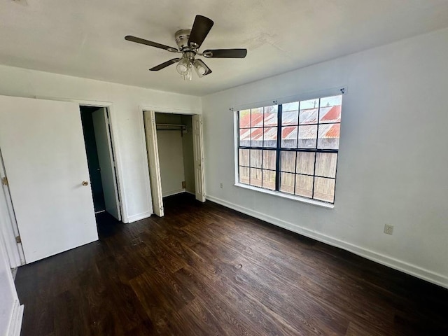 411 N Swenson St Unit 411, Falls City, TX 78113 - unfurnished bedroom with dark wood finished floors, baseboards, a closet, and ceiling fan