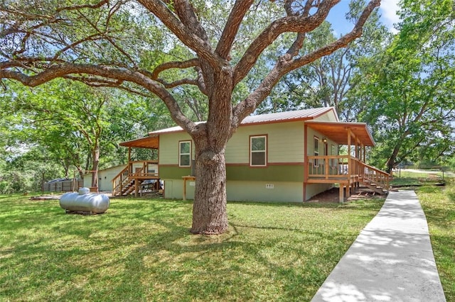 242 Meadow Lake Dr, Seguin, TX 78155 - view of side of property featuring stairway, a lawn, and a wooden deck