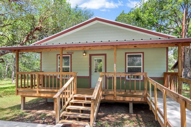 242 Meadow Lake Dr, Seguin, TX 78155 - view of front of property featuring a deck and metal roof