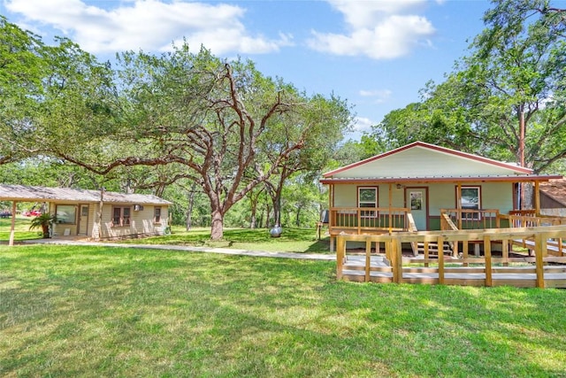 242 Meadow Lake Dr, Seguin, TX 78155 - rear view of property featuring covered porch and a lawn