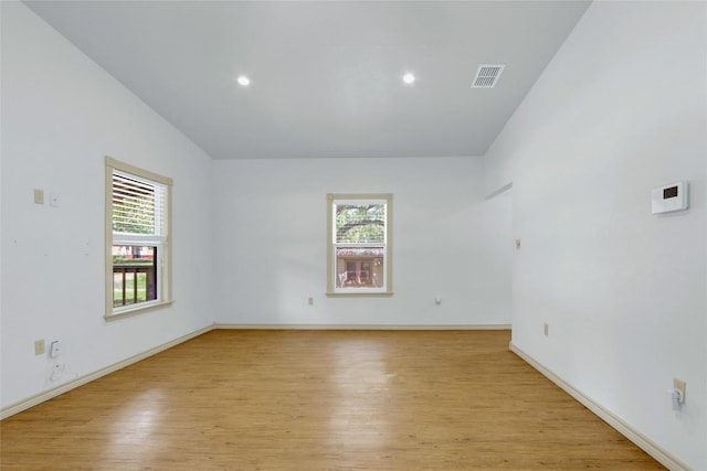 242 Meadow Lake Dr, Seguin, TX 78155 - empty room with healthy amount of natural light, light wood-style flooring, baseboards, and recessed lighting