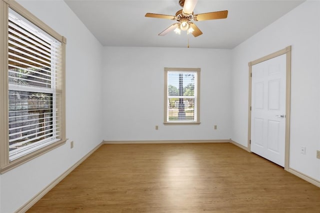 242 Meadow Lake Dr, Seguin, TX 78155 - empty room with light wood-style flooring, a ceiling fan, and baseboards