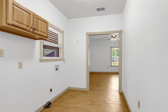 242 Meadow Lake Dr, Seguin, TX 78155 - washroom with cabinet space, hookup for a washing machine, light wood-style floors, and ceiling fan