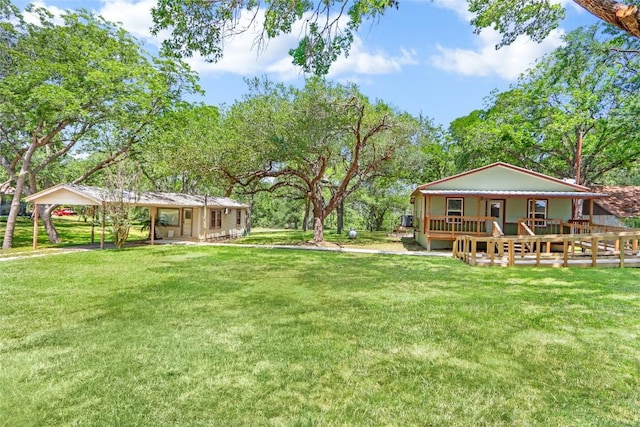 242 Meadow Lake Dr, Seguin, TX 78155 - view of grassy yard featuring covered porch and a carport