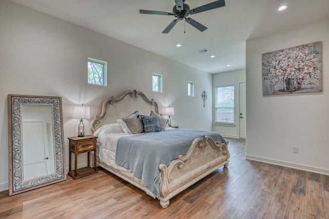302 Parallel Cir, Horseshoe Bay, TX 78657 - bedroom with wood finished floors, recessed lighting, baseboards, and a ceiling fan
