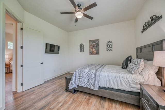 302 Parallel Cir, Horseshoe Bay, TX 78657 - bedroom featuring light wood-style floors, baseboards, and a ceiling fan