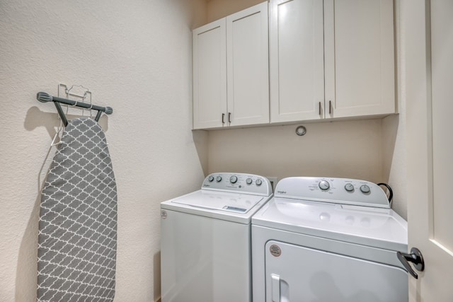 302 Parallel Cir, Horseshoe Bay, TX 78657 - laundry area with independent washer and dryer, cabinet space, and a textured wall