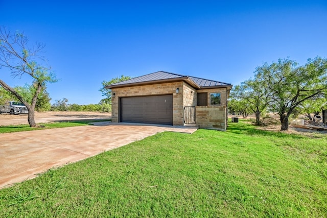 302 Parallel Cir, Horseshoe Bay, TX 78657 - view of front facade with a standing seam roof, driveway, an attached garage, stone siding, and a front lawn