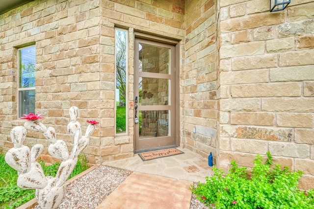 302 Parallel Cir, Horseshoe Bay, TX 78657 - doorway to property with stone siding