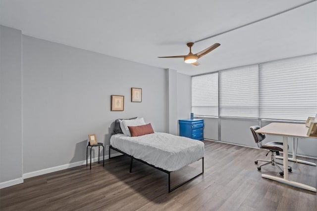 1800 Lavaca St Unit 307, Austin, TX 78701 - bedroom featuring wood finished floors, a desk, and ceiling fan