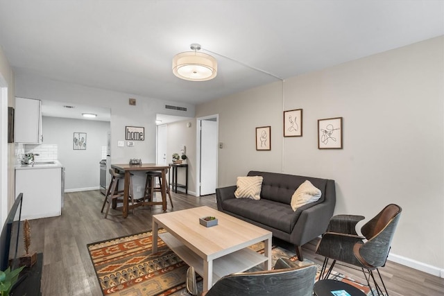 1800 Lavaca St Unit 307, Austin, TX 78701 - living room featuring wood finished floors and baseboards