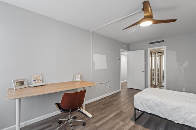 1800 Lavaca St Unit 307, Austin, TX 78701 - bedroom featuring wood finished floors, a desk, and ceiling fan