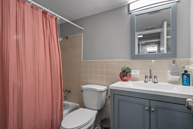 1800 Lavaca St Unit 307, Austin, TX 78701 - full bath featuring vanity, shower / tub combo, tile walls, and wainscoting
